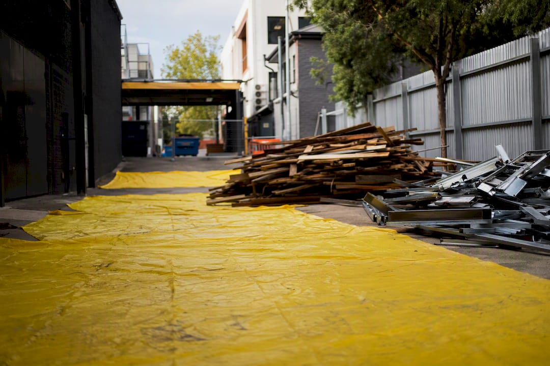 Protected site entrance with tarps and segregated debris