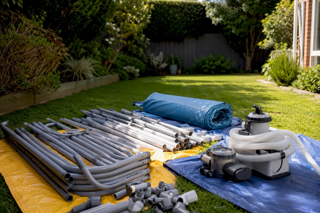 Sorted disassembled above ground pool parts on ground