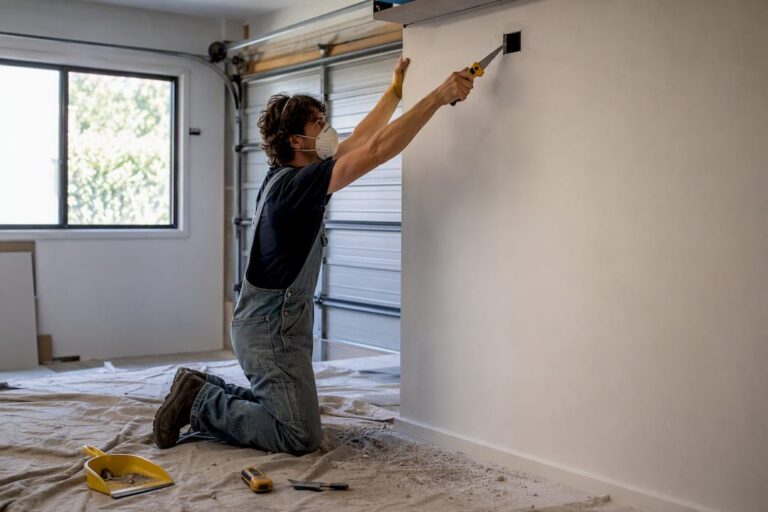 Person cutting inspection hole in partition wall