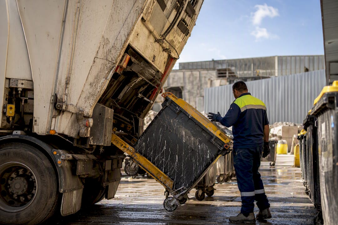 Rubbish truck unloading sorted demolition waste