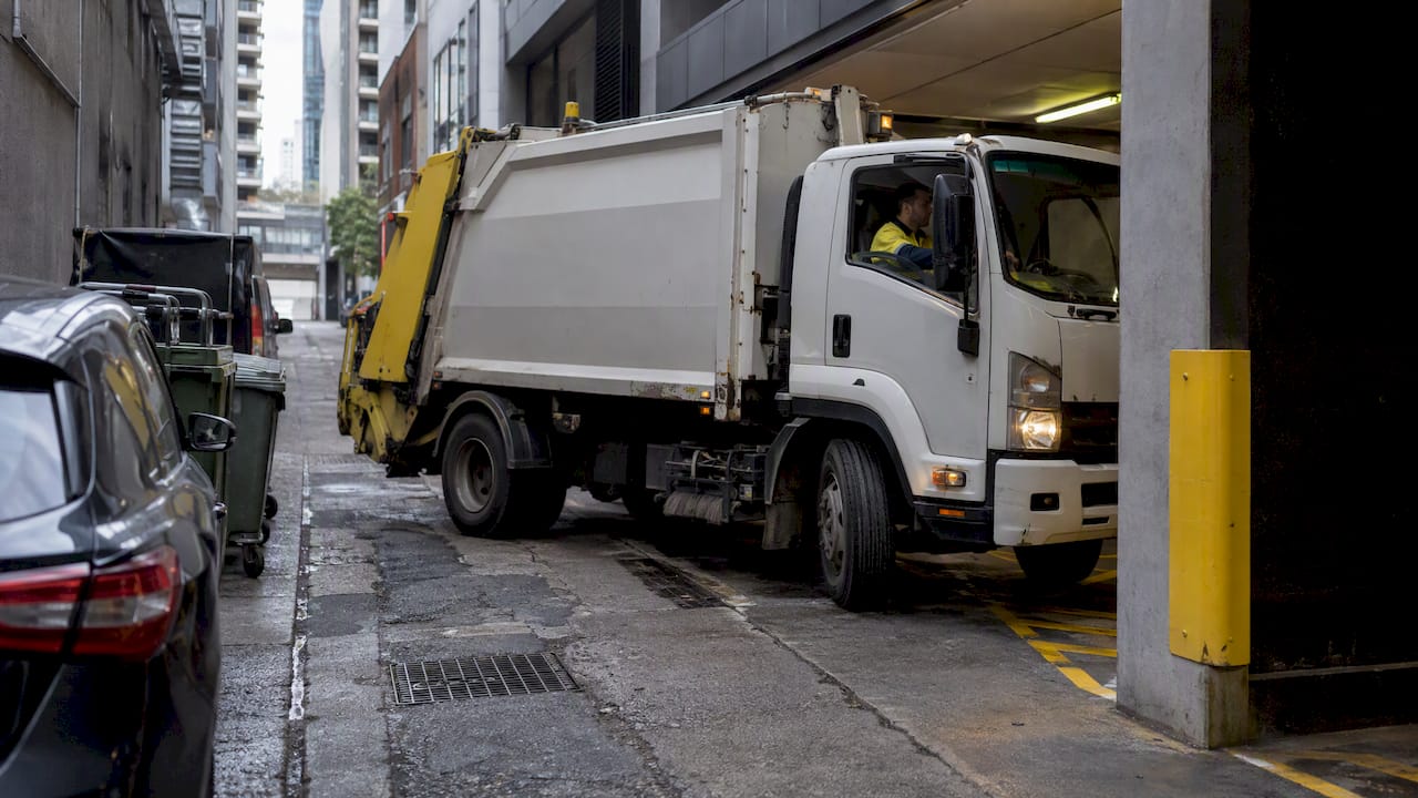 Removal truck navigating a narrow CBD laneway