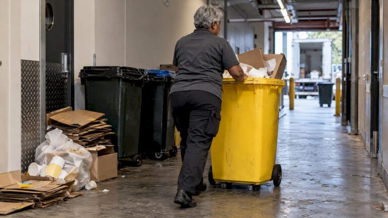 Worker removing rubbish after a Melbourne event