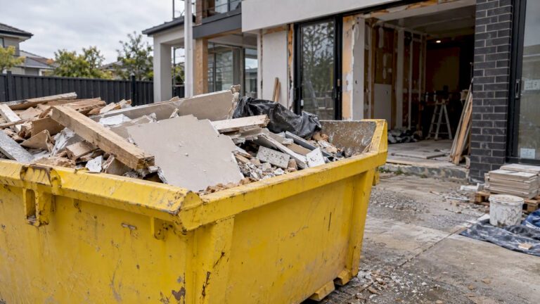 Construction debris in a yellow renovation skip